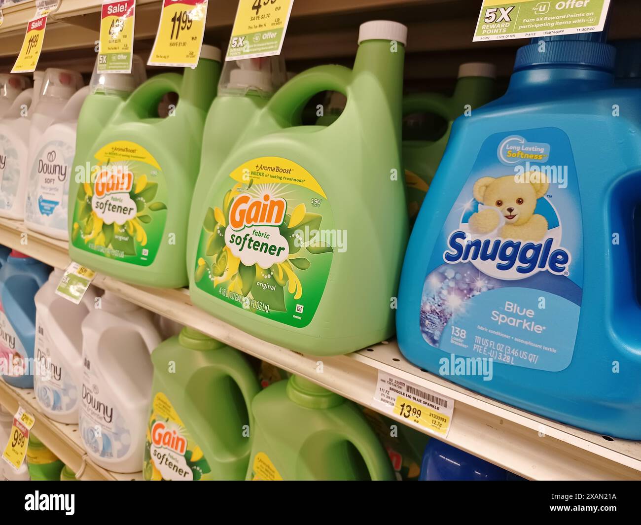 Fabric softener plastic bottles assorted brands on store shelf Houston