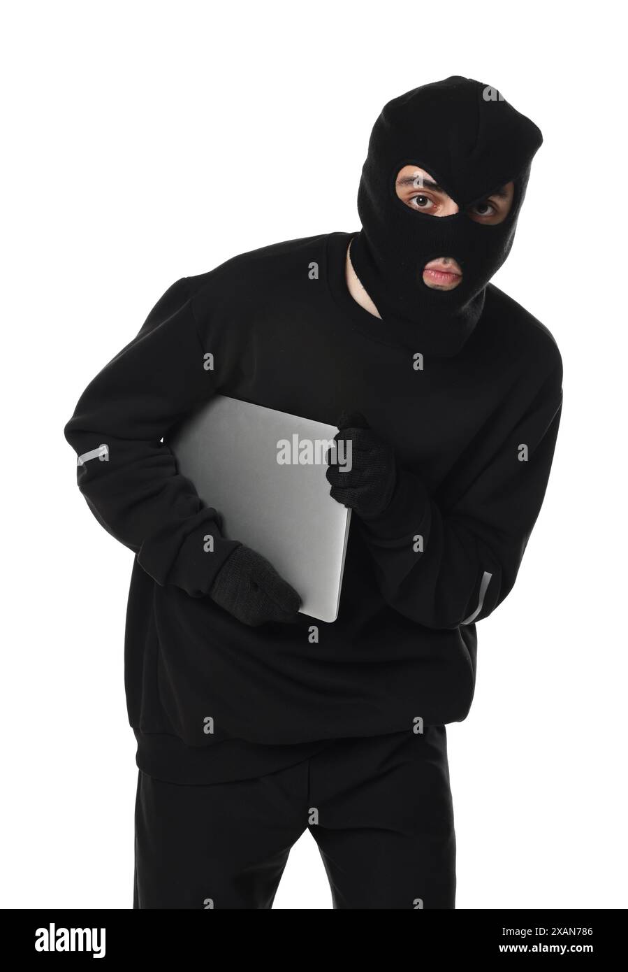 Thief in balaclava with laptop on white background Stock Photo - Alamy