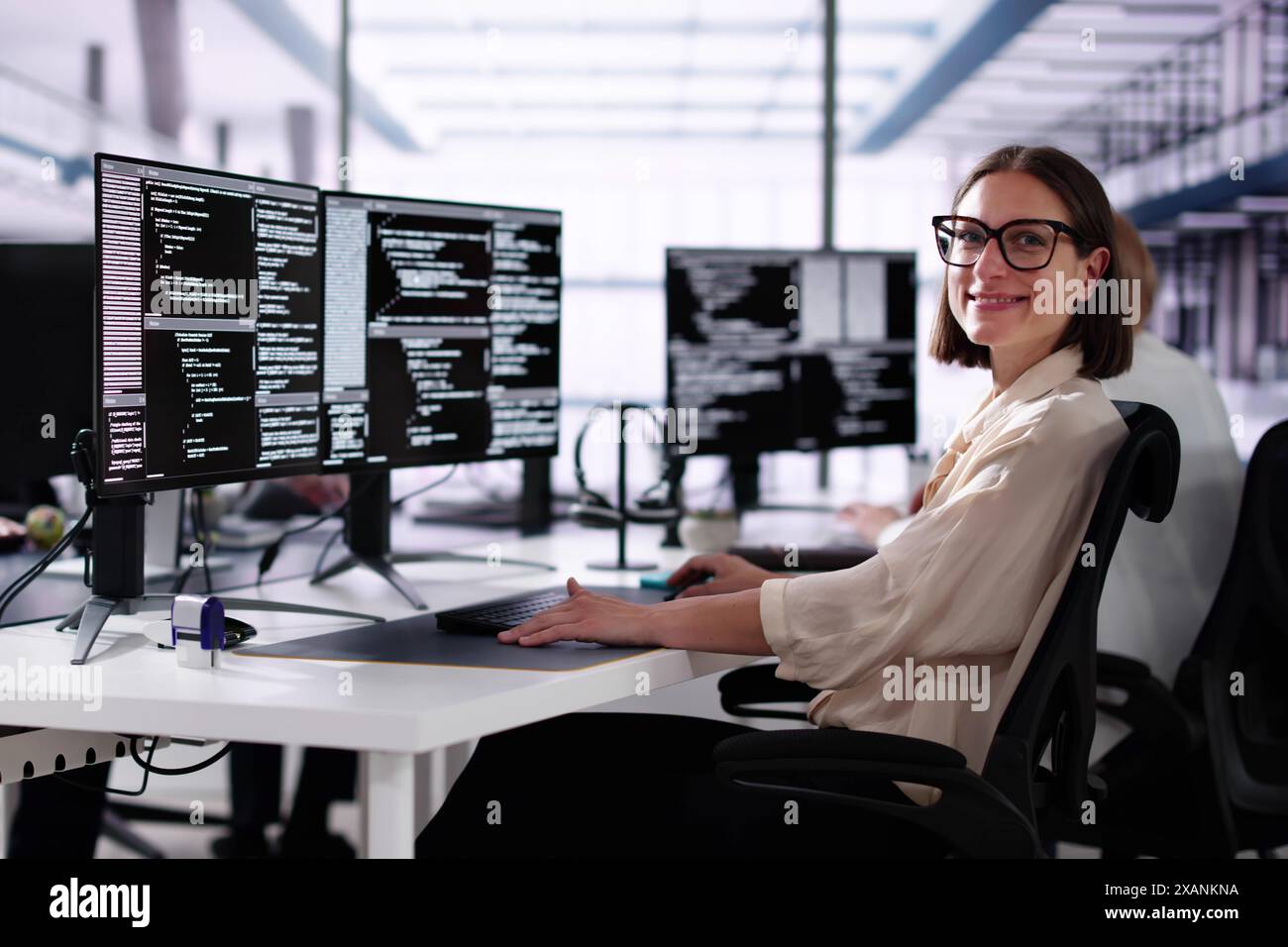 African American Coder Using Computer At Desk. Web Developer Stock Photo