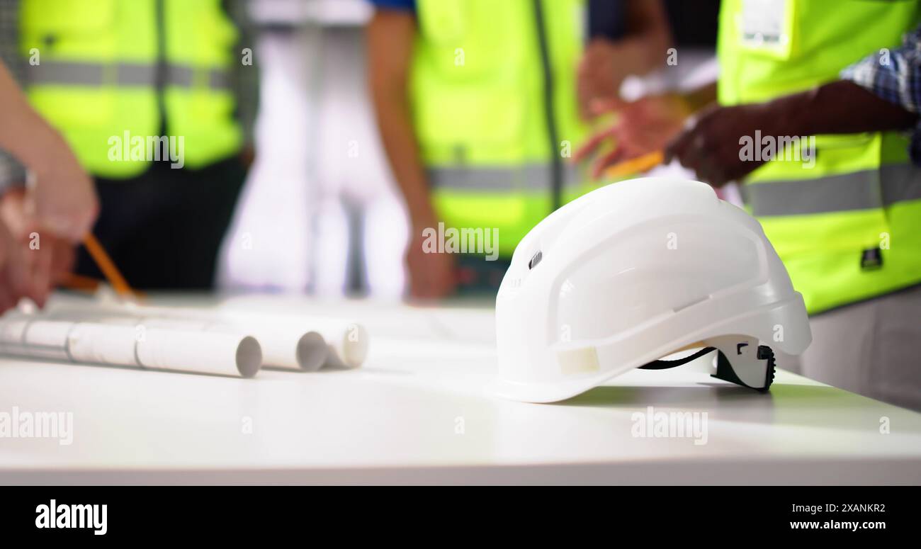 Civil Engineer Or Architect Team With Construction Plans Stock Photo