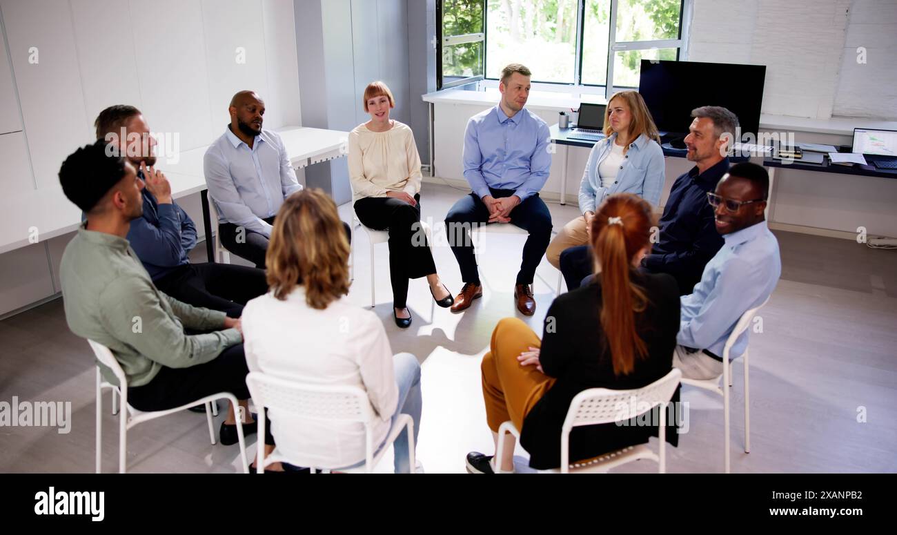 Business Communication In Office And Teamwork. Sitting Meeting Stock Photo