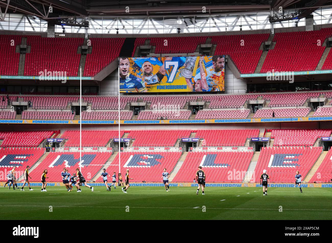 A tribute to Rob Burrow is shown on the big screen after 7 minutes during the Steven Mullaney Memorial Game final at Wembley Stadium, London. Picture date: Saturday June 8, 2024. Stock Photo