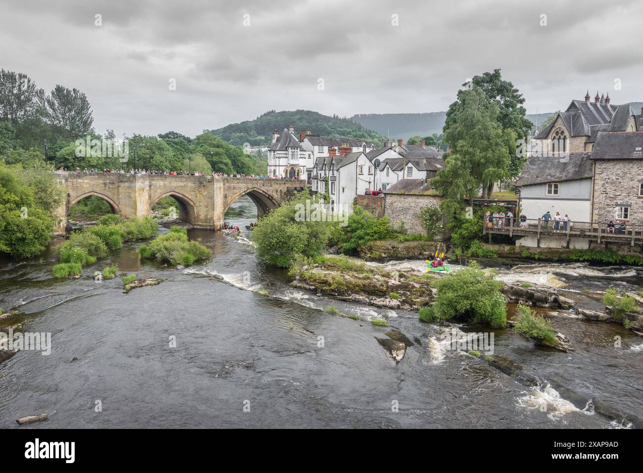 Llangollen Bridge is built across the River Dee on the High street in the Welsh town of Llangollen listed as one of the seven wonders of Wales. Stock Photo