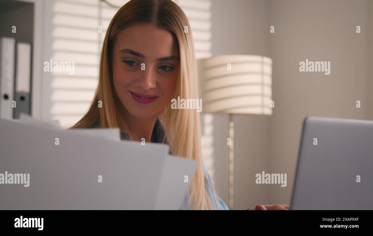 smiling student with laptop computer and documents Stock Photo - Alamy