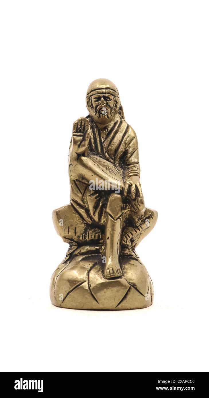 hindu saint sai baba guru golden statue isolated in a white background Stock Photo