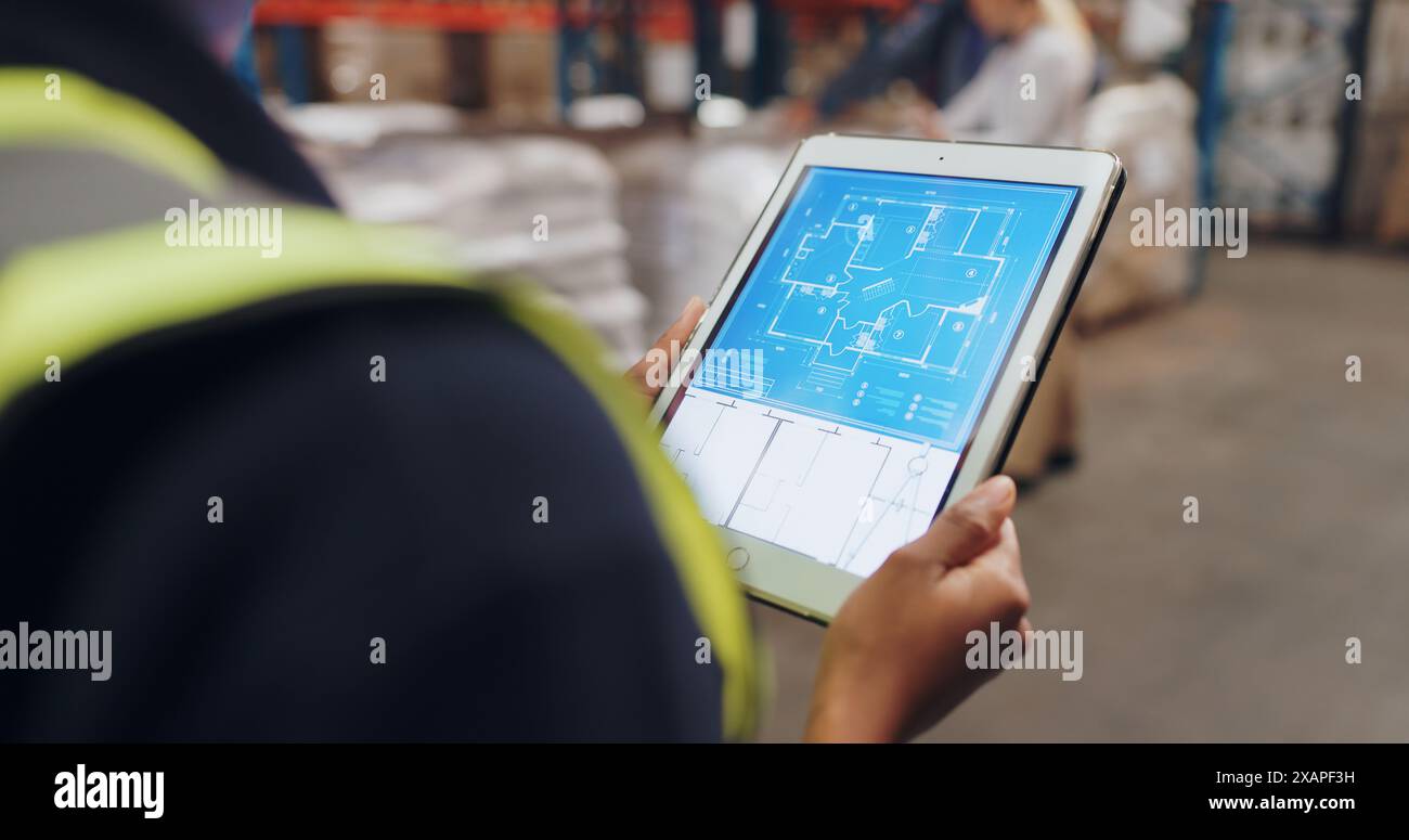 Hands, architect and tablet with app for blueprint in warehouse for building, design and ideas for inspection. Contractor, touchscreen and person for Stock Photo