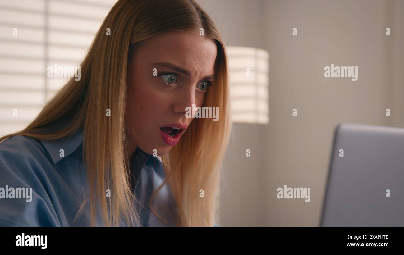 Close up angry upset Caucasian woman user using laptop in home office ...