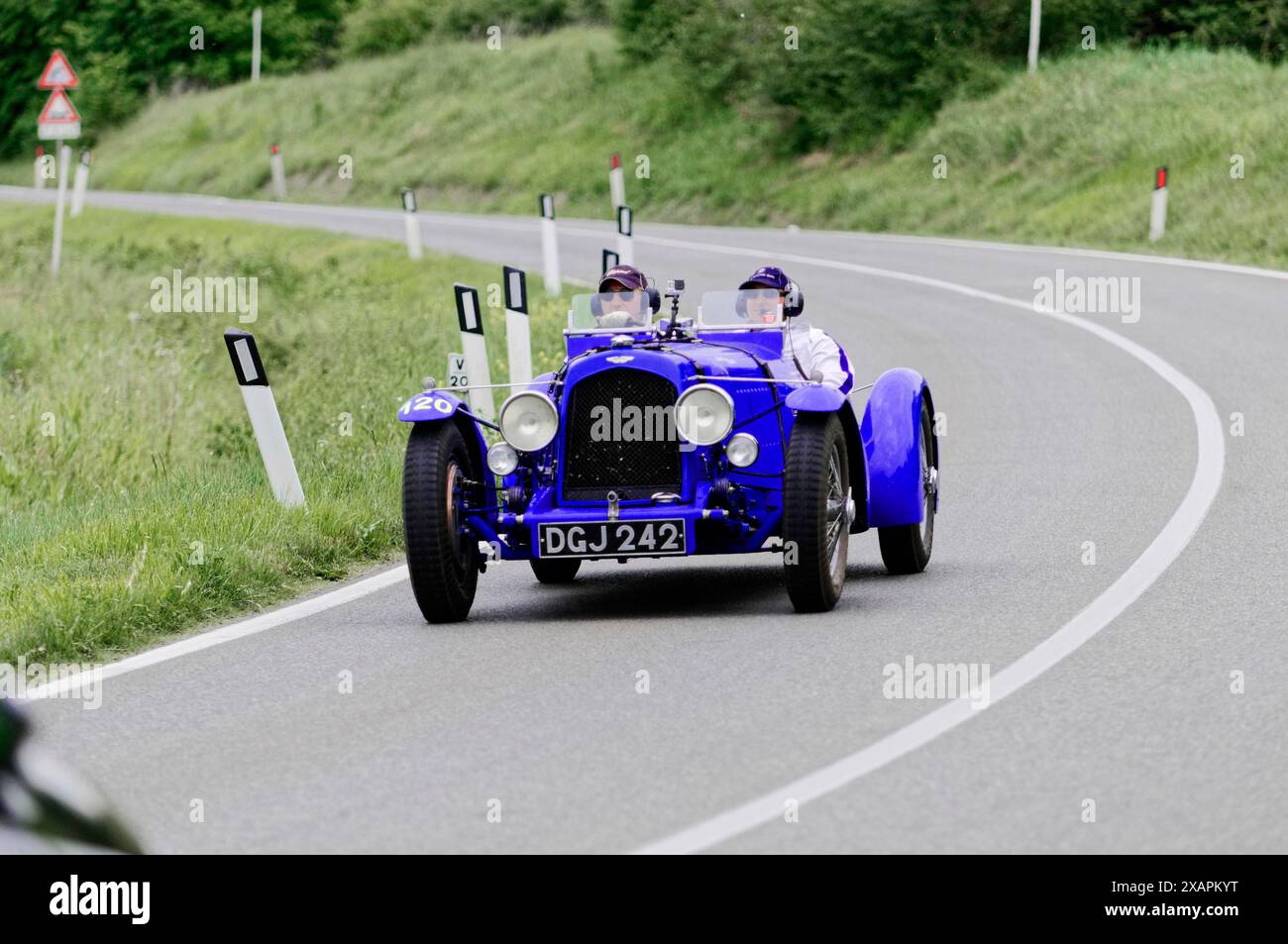 Blue classic car on a country road, driver wearing goggles, classic car, car race, Mille Miglia, 1000 Miglia, Tuscany, Rome, Lake Garda, Italy Stock Photo