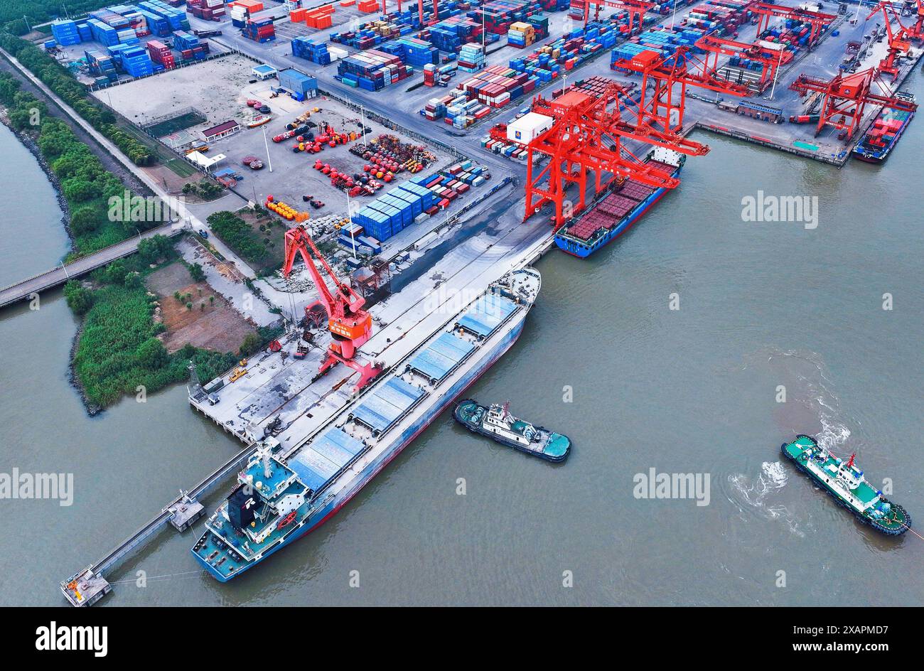 RUGAO, CHINA - JUNE 8, 2024 - Cargo ships work at the berth of Suzhong ...