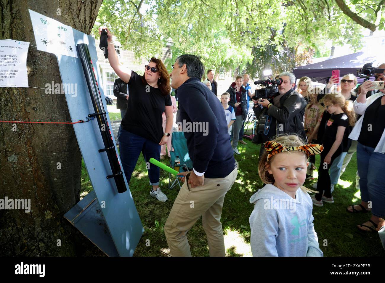 Prime Minister Rishi Sunak playing 'Splat the Rat' at a village fete in ...