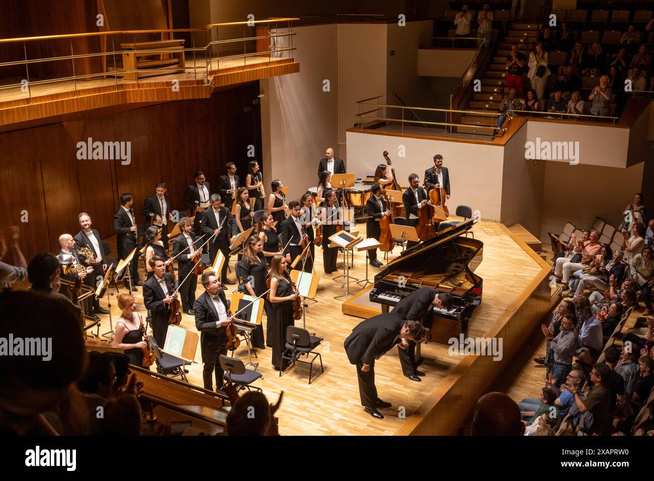 soloist and conductor bowing while receiving applause, National Music Auditorium, Madrid, Spain Stock Photo