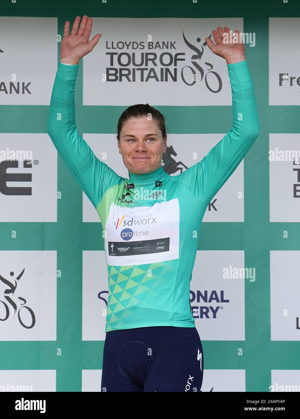 Lotte Kopecky celebrates with the race leaders jersey, after stage three of the Lloyds Bank