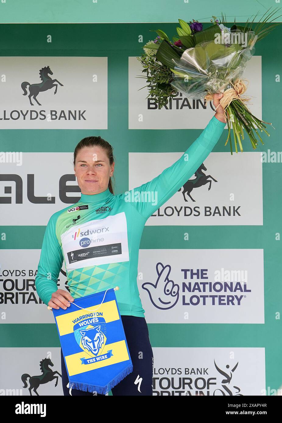Lotte Kopecky celebrates with the race leaders jersey, after stage