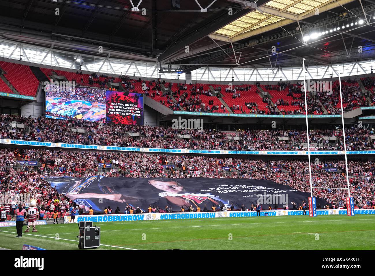 A large banner is carried by fans across the stadium in tribute to Rob ...