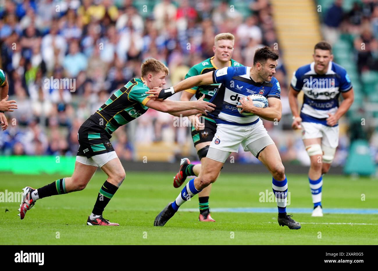 Bath Rugby's Will Muir (right) is tackled by Northampton Saints' Fin Smith (left) during the Gallagher Premiership final at Twickenham Stadium, London. Picture date: Saturday June 8, 2024. Stock Photo