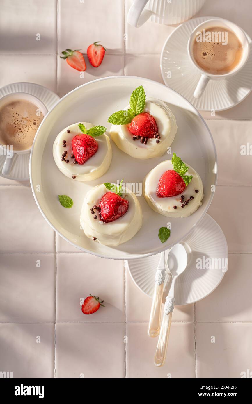 Delicious cheesecake monoportion with strawberries and vanilla glazed