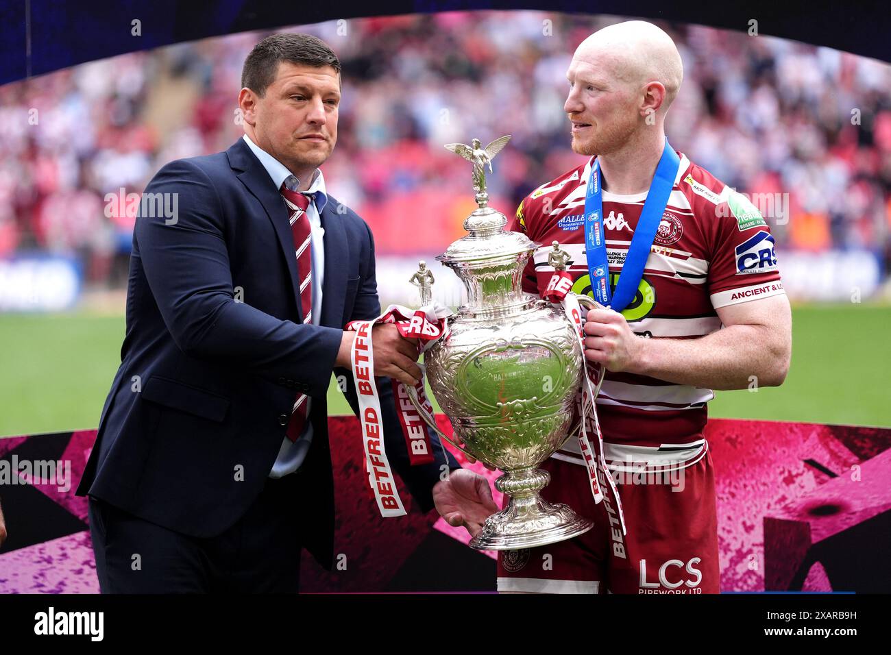 Wigan Warriors head coach Matt Peet (left) celebrates with player Liam Farrell after the final whistle in the Betfred Challenge Cup final at Wembley Stadium, London. Picture date: Saturday June 8, 2024. Stock Photo