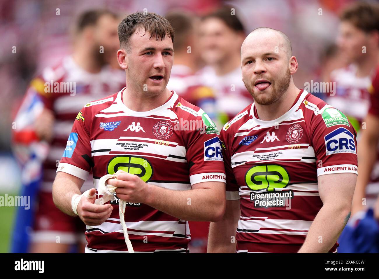 Wigan Warriors' Harry Smith (left) and Liam Marshall celebrate during the Betfred Challenge Cup final at Wembley Stadium, London. Picture date: Saturday June 8, 2024. Stock Photo