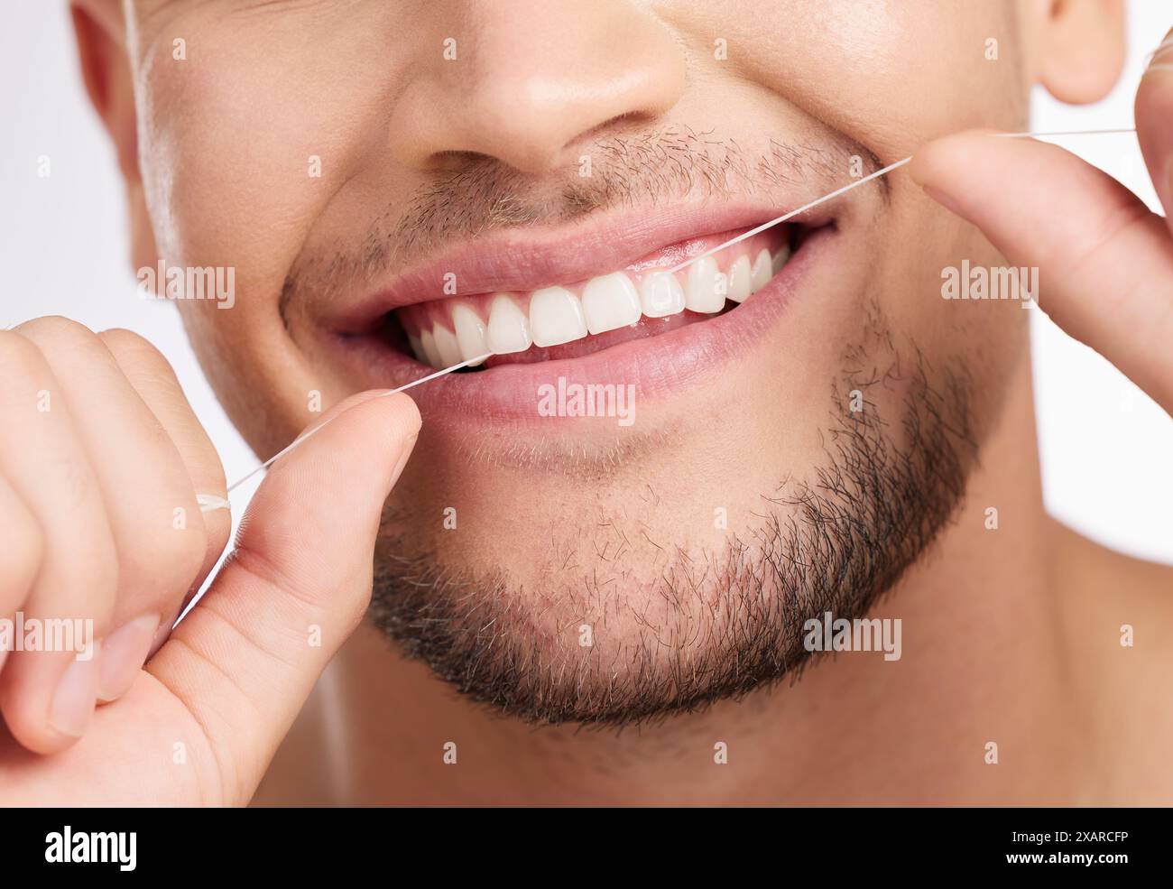Closeup, man and flossing teeth for hygiene with wellness, mouth care ...