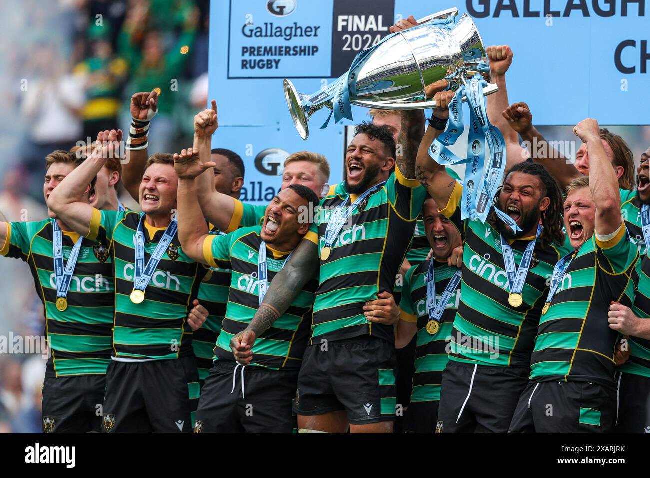 London, England. Saturday June 8, 2024. Northampton Saints' celebrate with the trophy during the ...