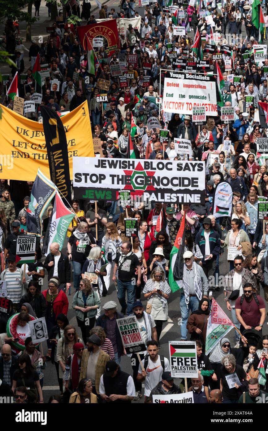 London, UK. 8 June, 2024. Tens of thousands of Palestine supporters march through central London to Parliament Square in a protest organised by a coalition of groups including the Palestine Solidarity Campaign, Stop The War Coalition, Friends of Al Aqsa and CND. The marchers called for a ceasefire and an end to UK and US support for Israel's siege, bombardment and invasion of Gaza following an attack by Hamas militants. Credit: Ron Fassbender/Alamy Live News Stock Photo