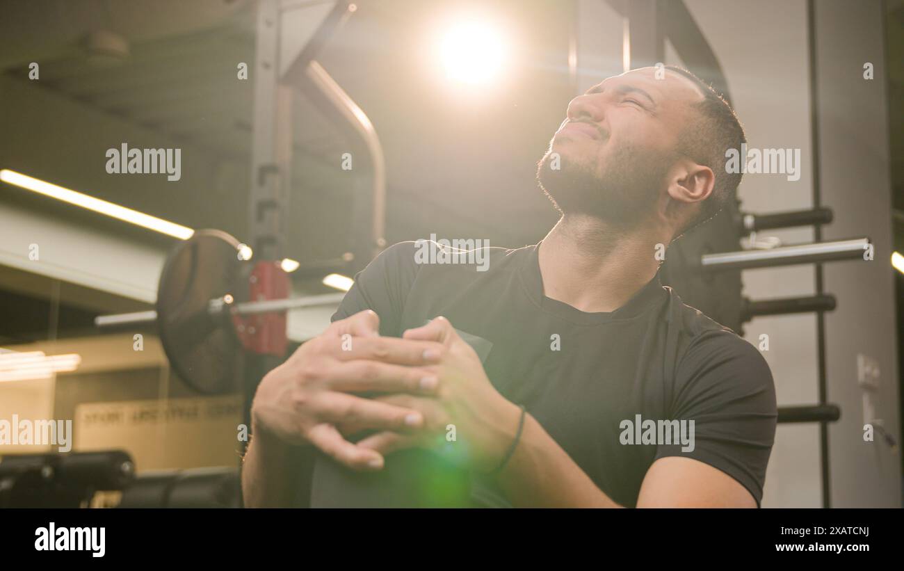 Sad suffering African American sportsman athlete runner sporty man feel ...