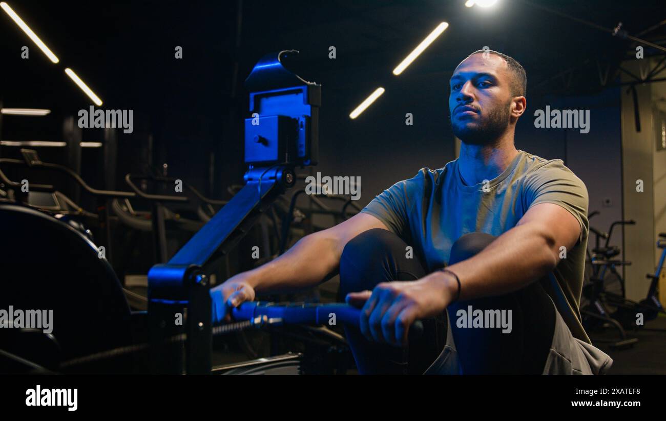 Sport functional training exercise biceps back muscles healthy African American trainer strong man sporty male guy athlete sportsman bodybuilder in Stock Photo