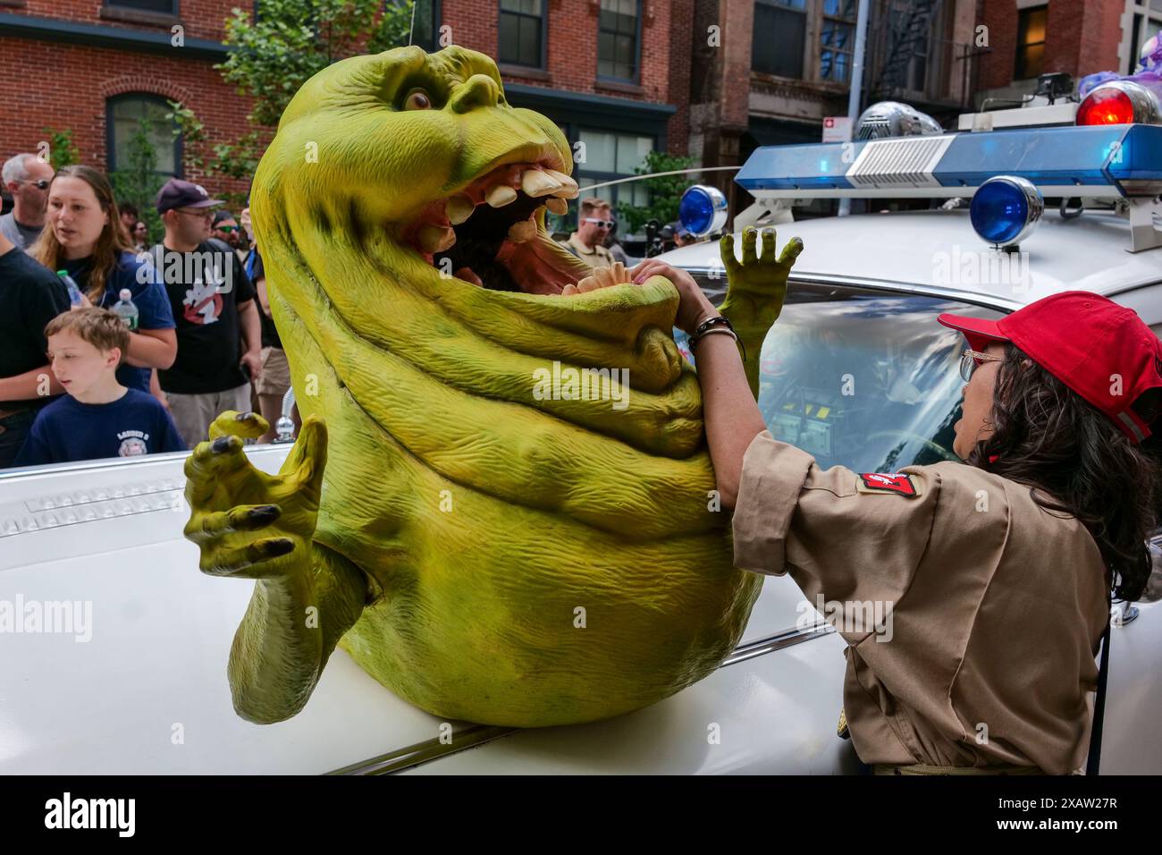 New York, New York, USA. 8th June, 2024. Fans converged on Tribeca Firehouse Ladder 8 to celebrate the 40th anniversary of Ghostbusters Day. Large crowds celebrated the release of the original Ghostbusters with music, multiple Ghostbuster ambulances, posters and costume. Ladder 8 is a functioning NYFD Firehouse and home to the original movie. (Credit Image: © Milo Hess/ZUMA Press Wire) EDITORIAL USAGE ONLY! Not for Commercial USAGE! Stock Photo