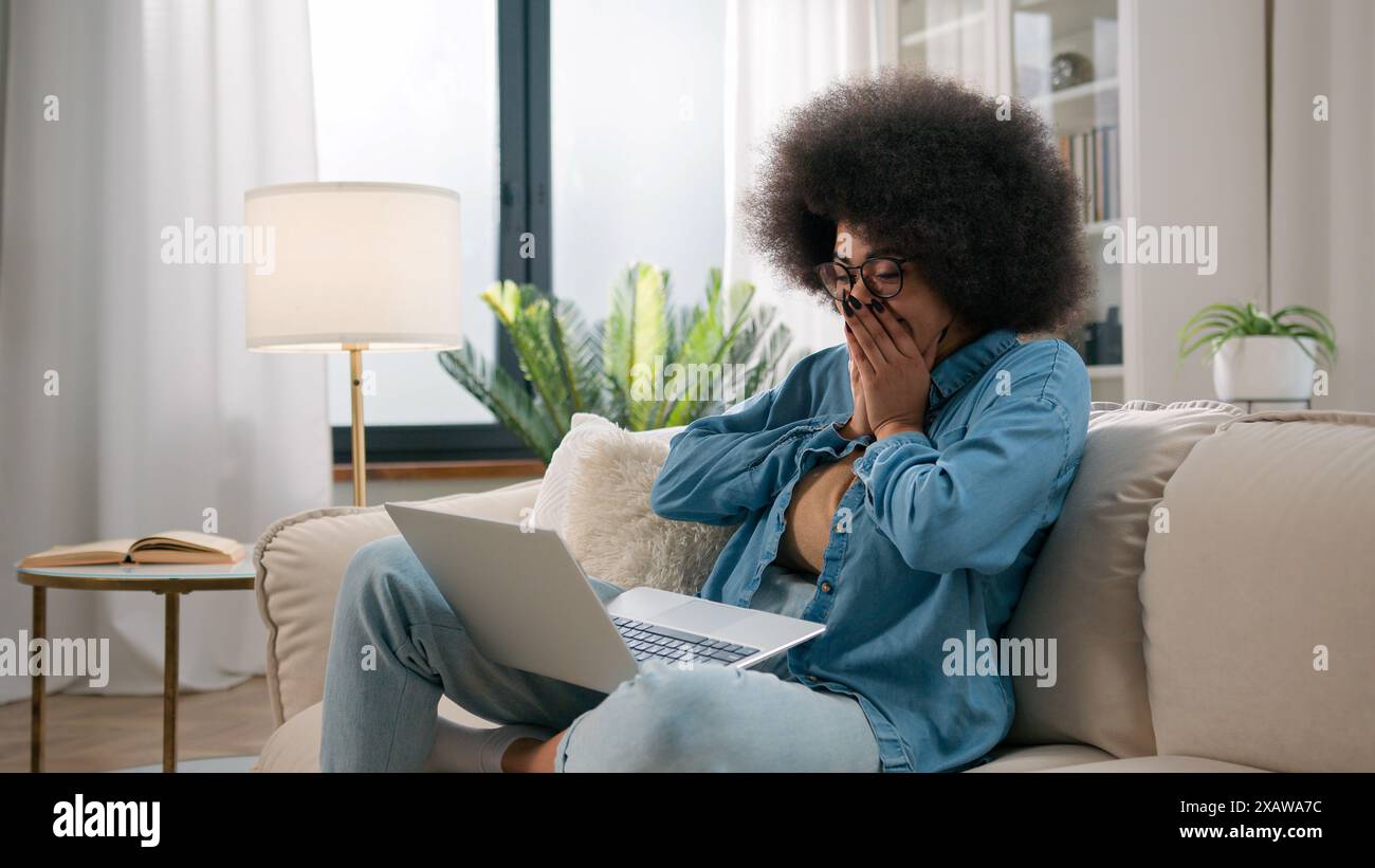 African woman laptop celebrating hi-res stock photography and images ...