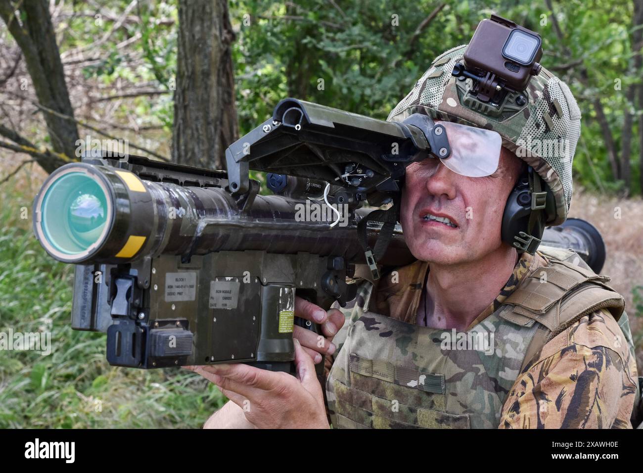 A Ukrainian serviceman searches for a target with a US Stinger air ...