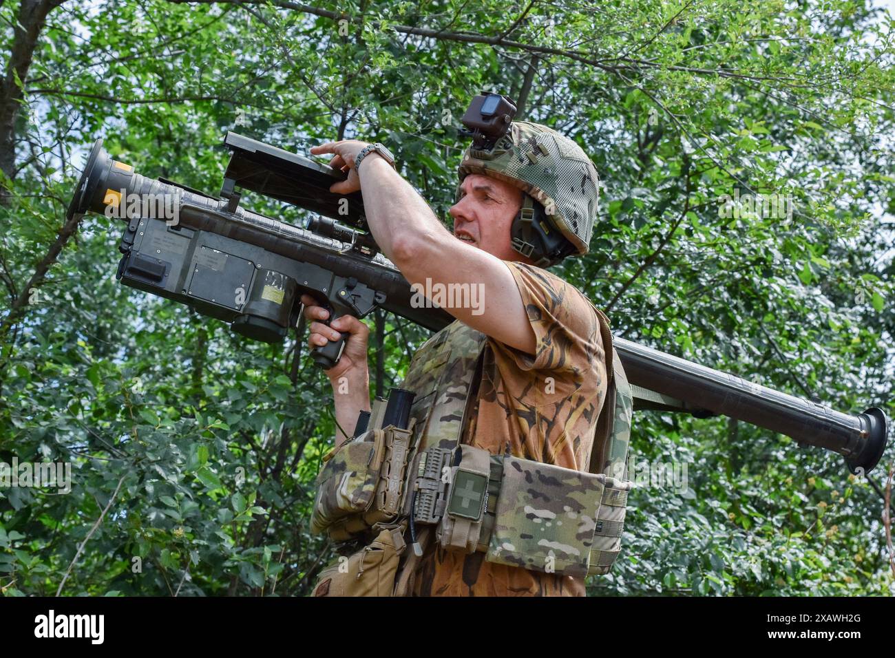 A Ukrainian serviceman searches for a target with a US Stinger air ...