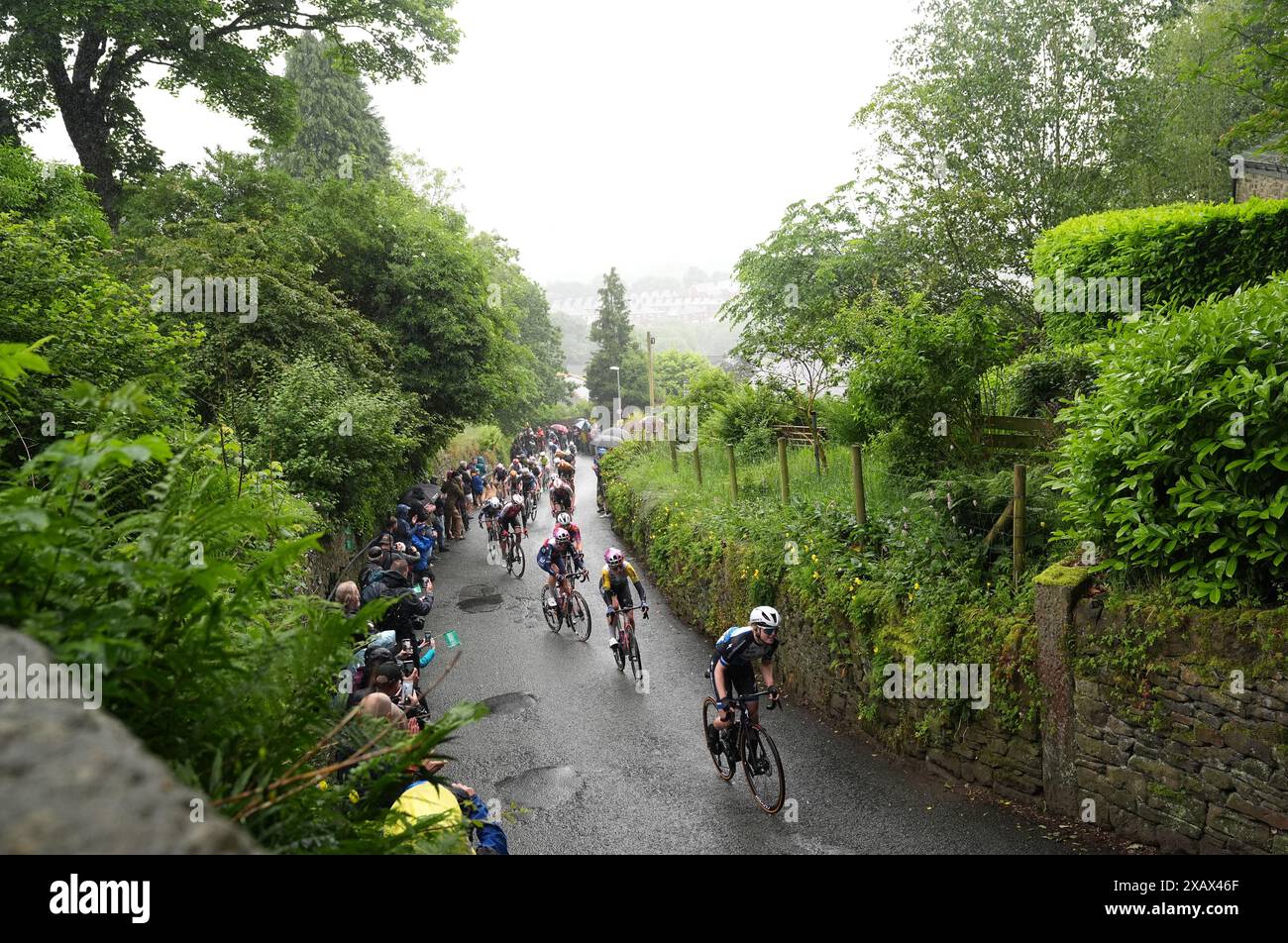 Riders heading up The Rake hill climb in Ramsbottom during stage four ...