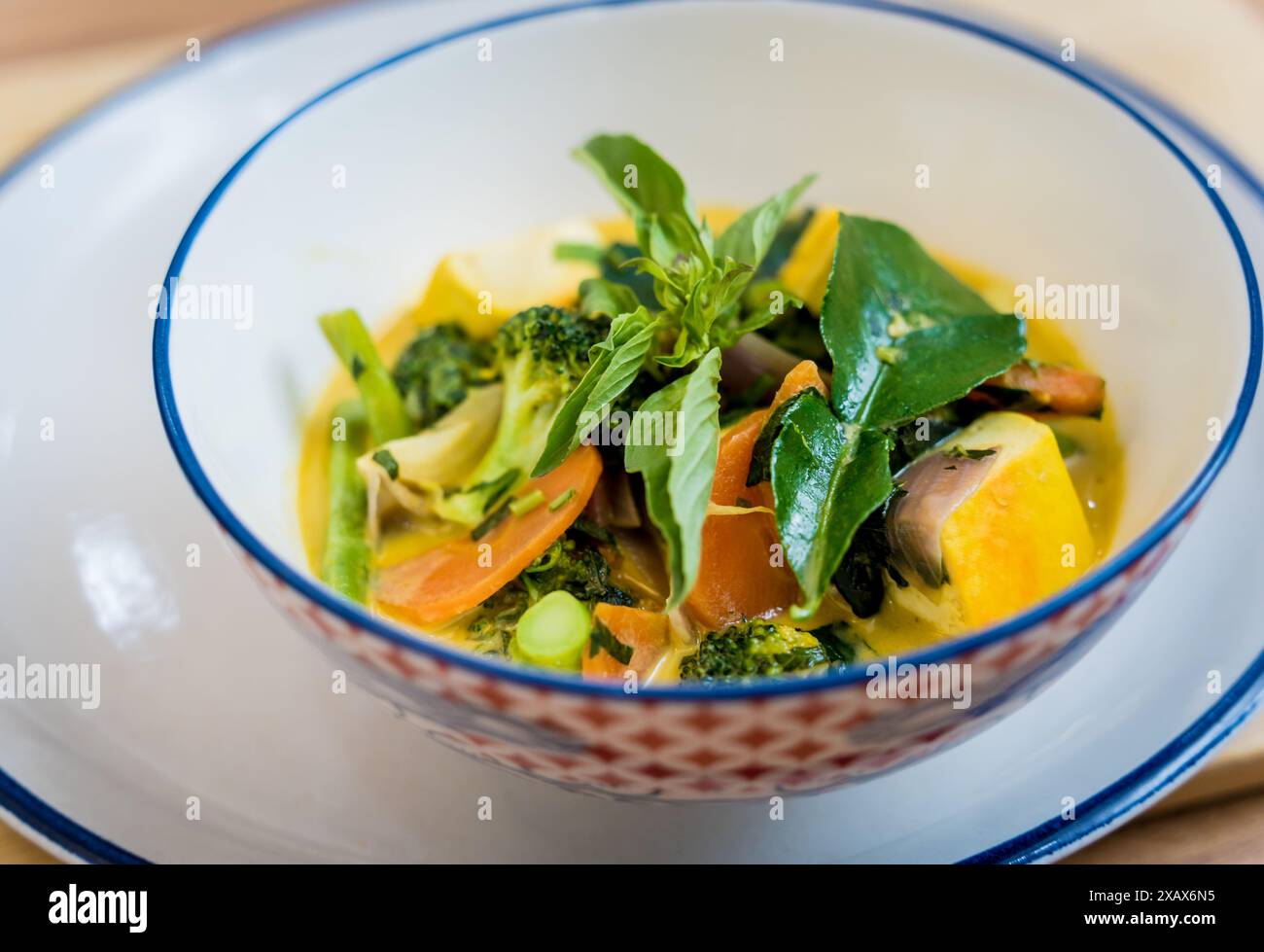 Traditional vegetable green curry with herbs and steamed rice Stock ...