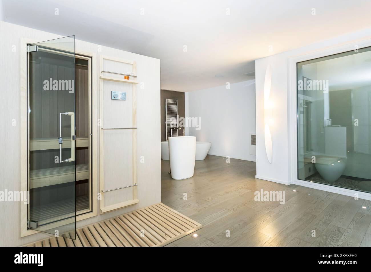 Bathroom of modern luxury house. Wooden floor. Modern sauna interior ...