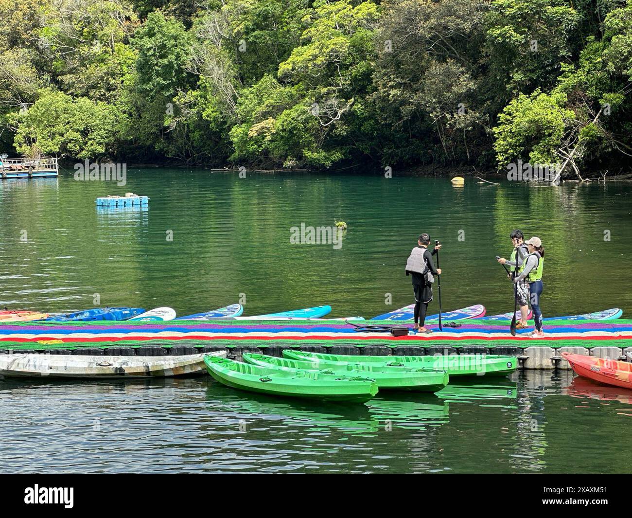 (240609) -- TAIPEI, June 9, 2024 (Xinhua) -- Tourists visit the scenic spot of Riyue Tan, or the Sun Moon Lake, during the holiday of the Dragon Boat Festival, also called Duanwu Festival, in Nantou County, southeast China's Taiwan, June 9, 2024. (Xinhua/Wang Chenghao) Stock Photo