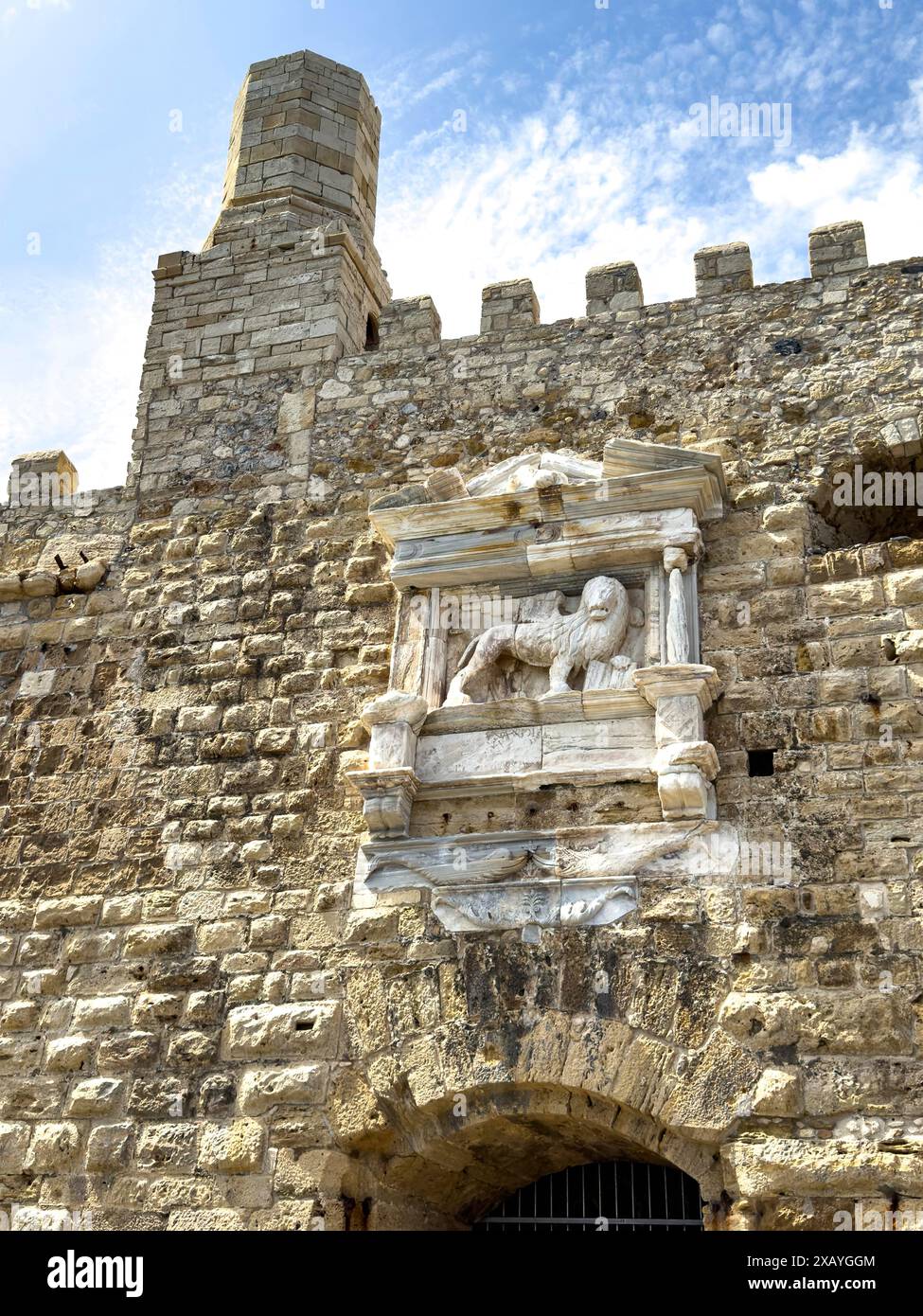 View of seaward outer wall with tower and battlements seen from harbour entrance of fortress built in the Middle Ages 16th century by Republic of Stock Photo