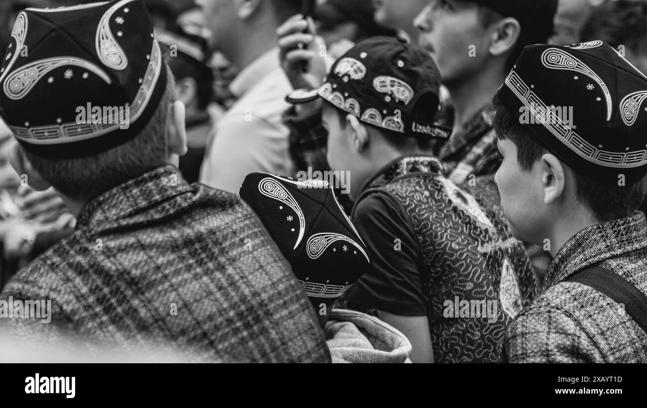 Black and white image of youths at Uzbek Culture and Food Festival in London. Stock Photo