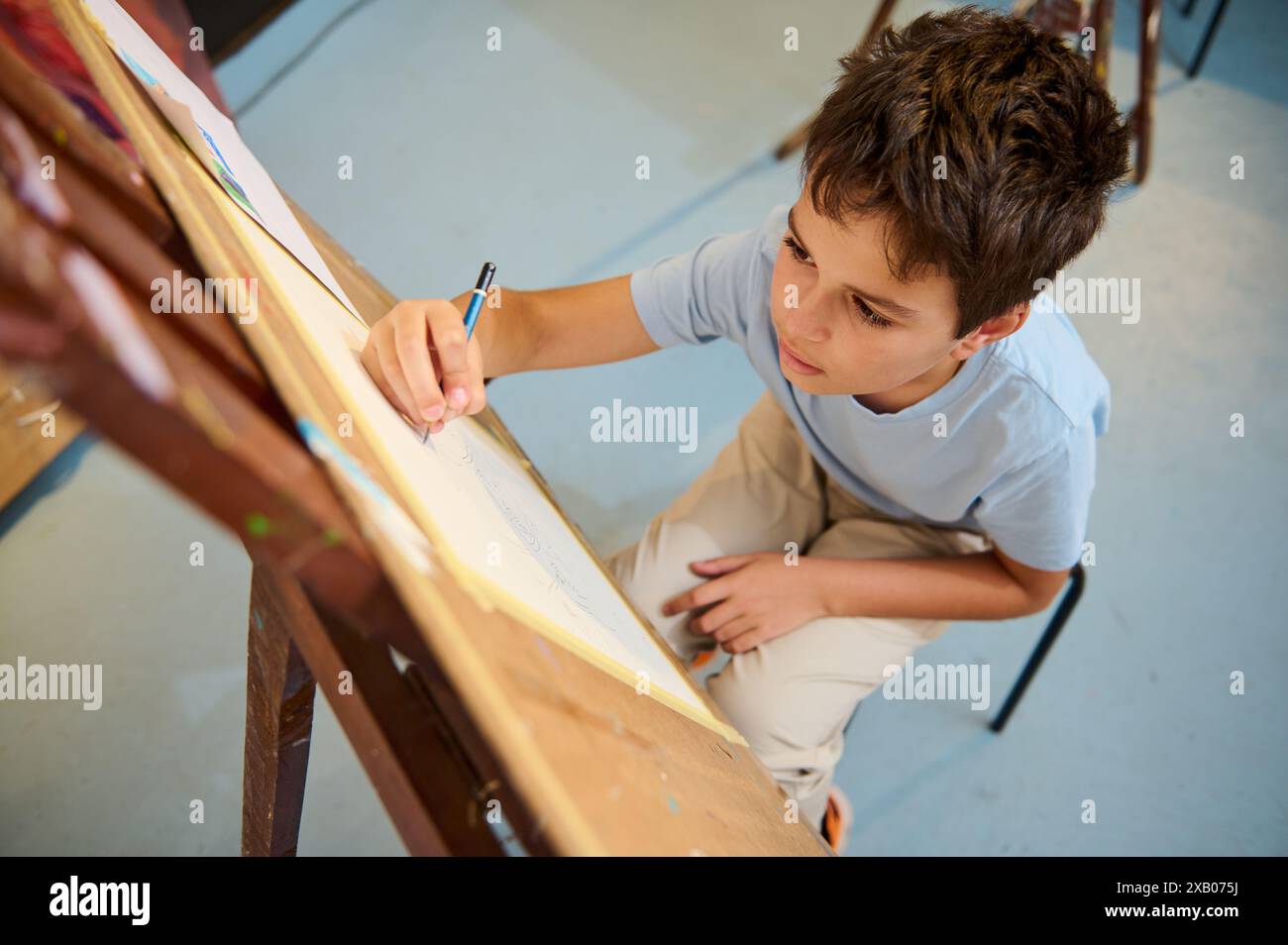 Kids have art class, drawing, painting with teacher in workshop Stock ...