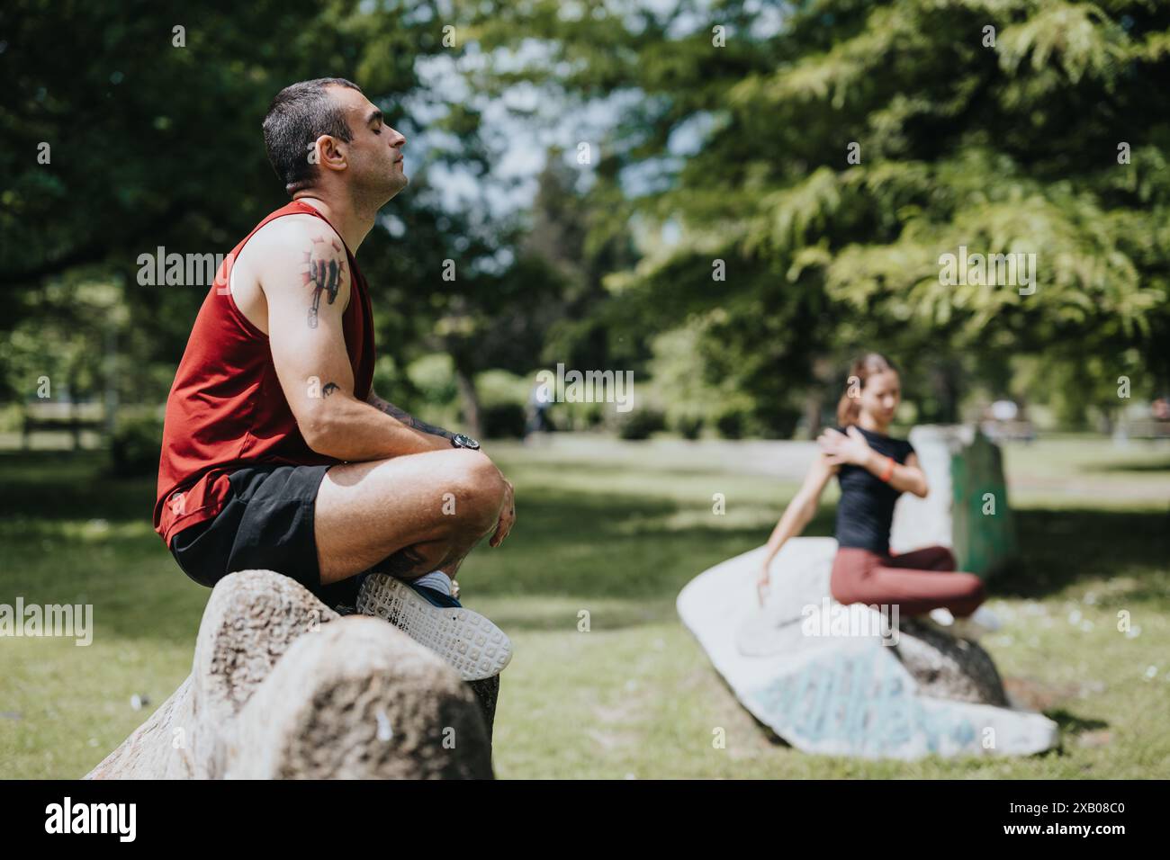 Image showcasing Sporty friends practicing wellness exercises at an urban park Stock ...