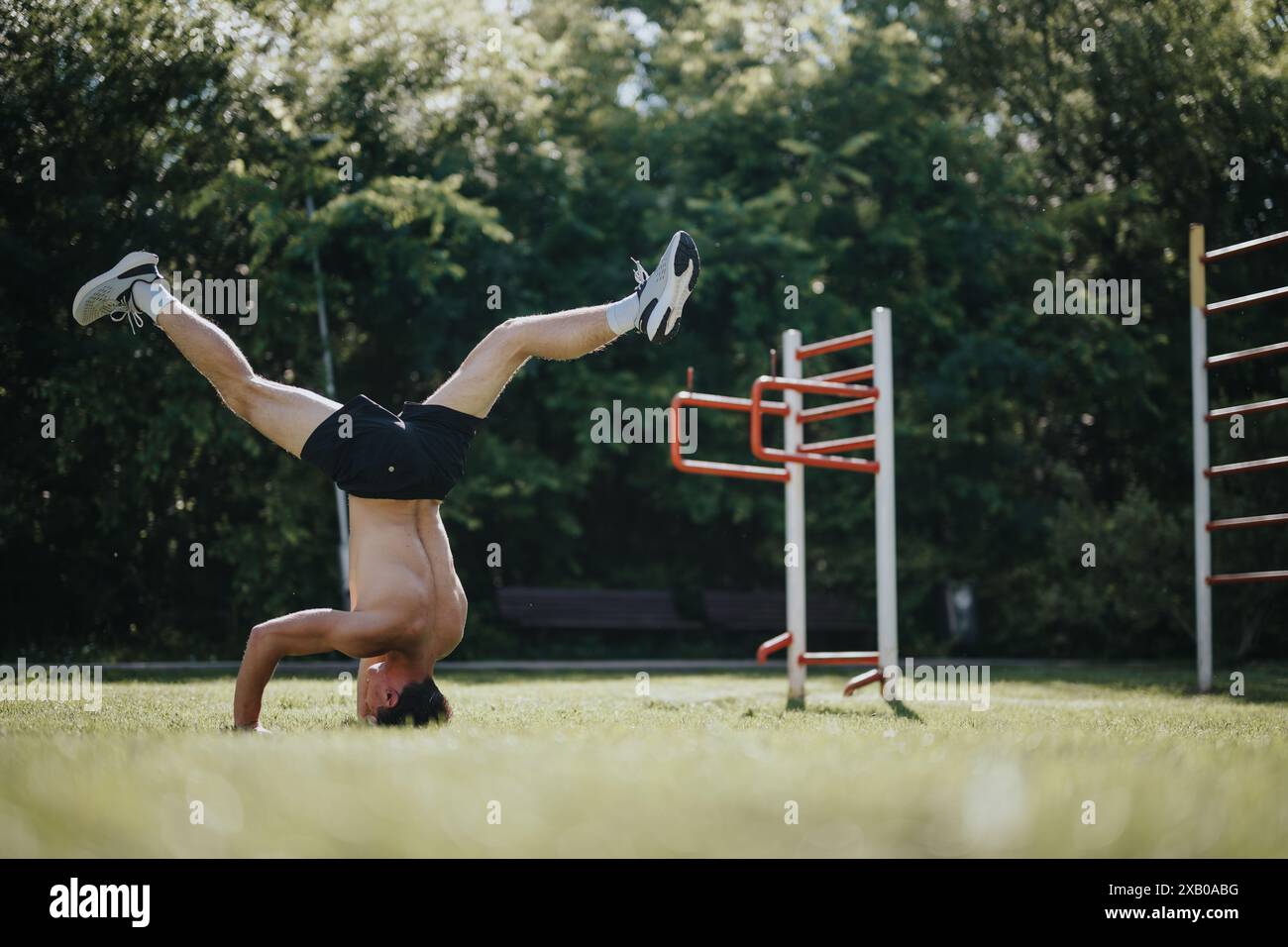 Man performing acrobatic handstand hi-res stock photography and images ...