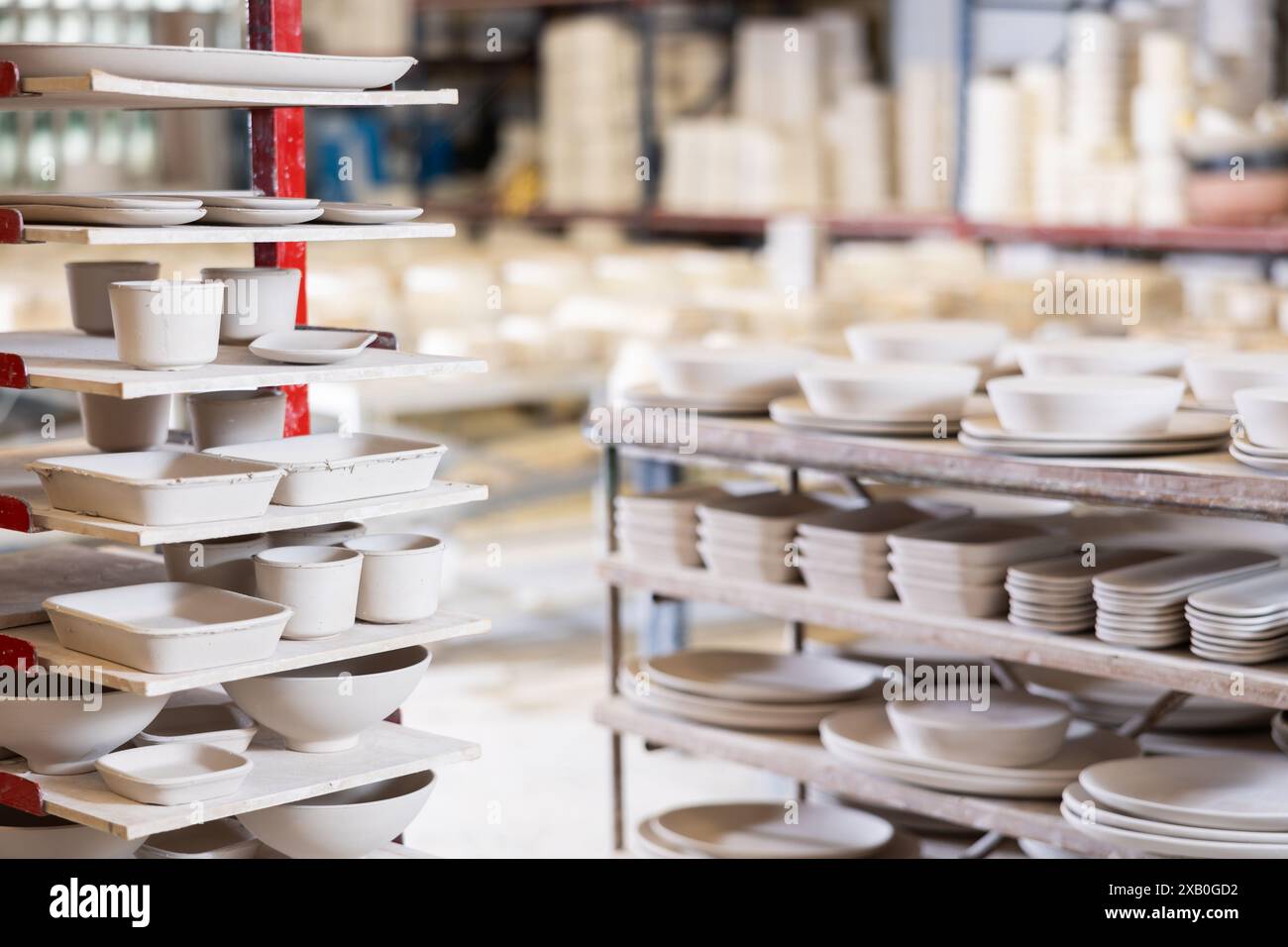 Ceramic dishes blanks on factory rack Stock Photo - Alamy