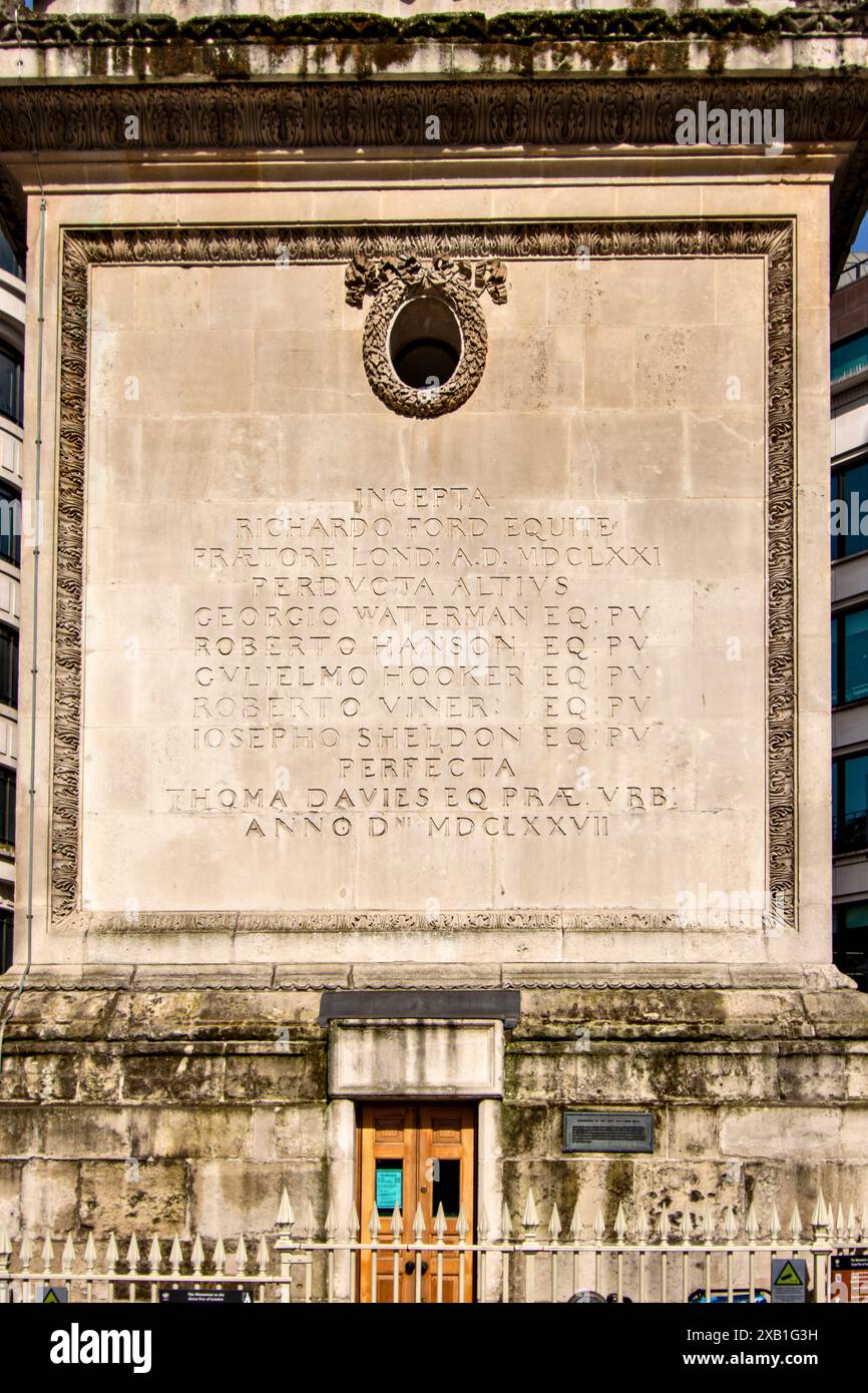 Monument to the Great Fire of London  Latin inscription names on a side of the base of the column Stock Photo