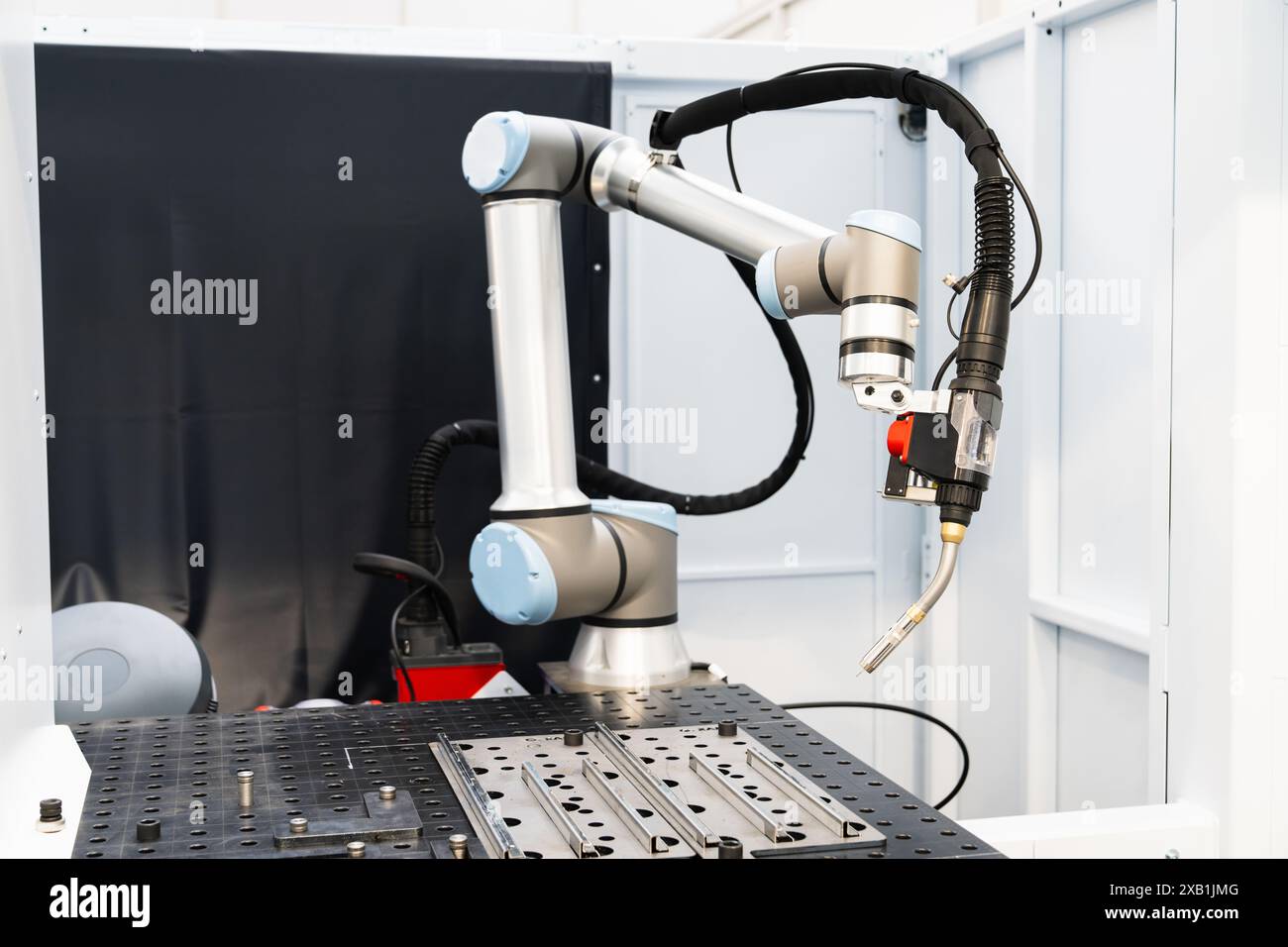 Automatic welding robot in a modern factory in operation Stock Photo