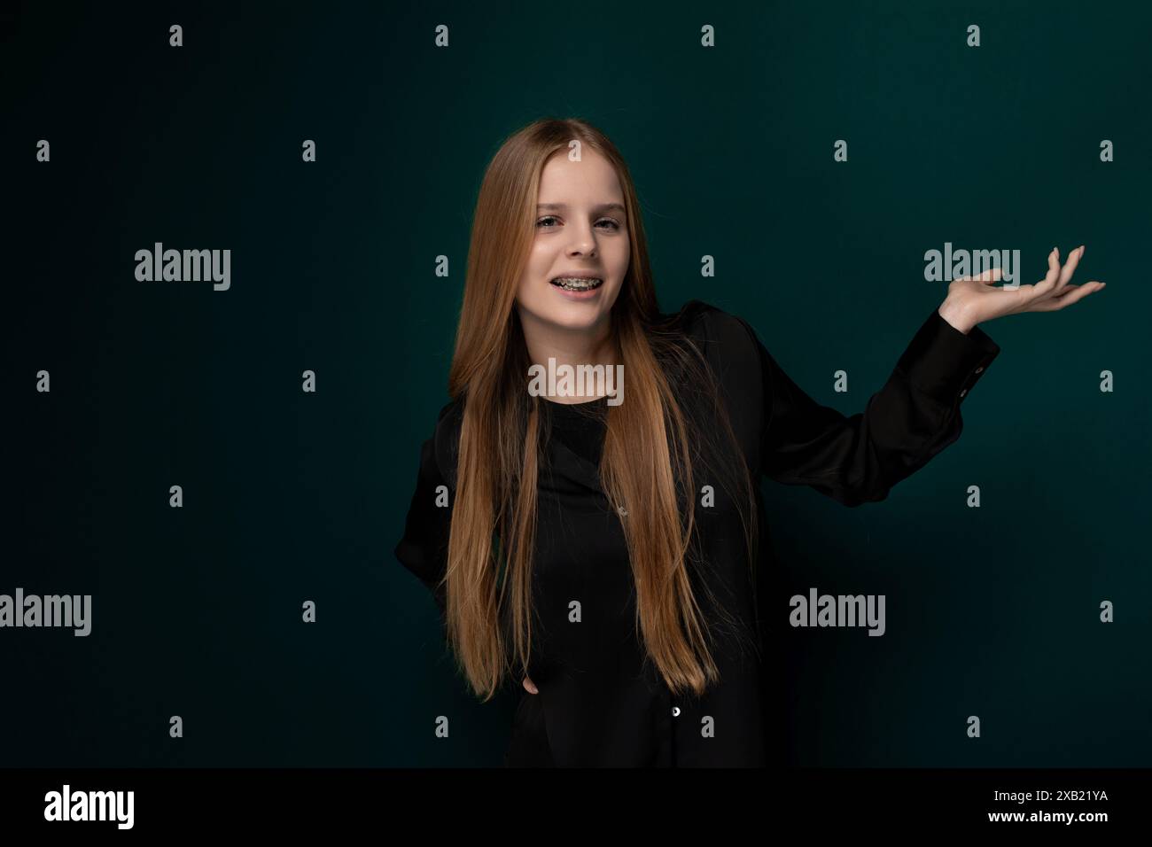 Woman With Long Red Hair Standing in Front of Green Wall Stock Photo ...