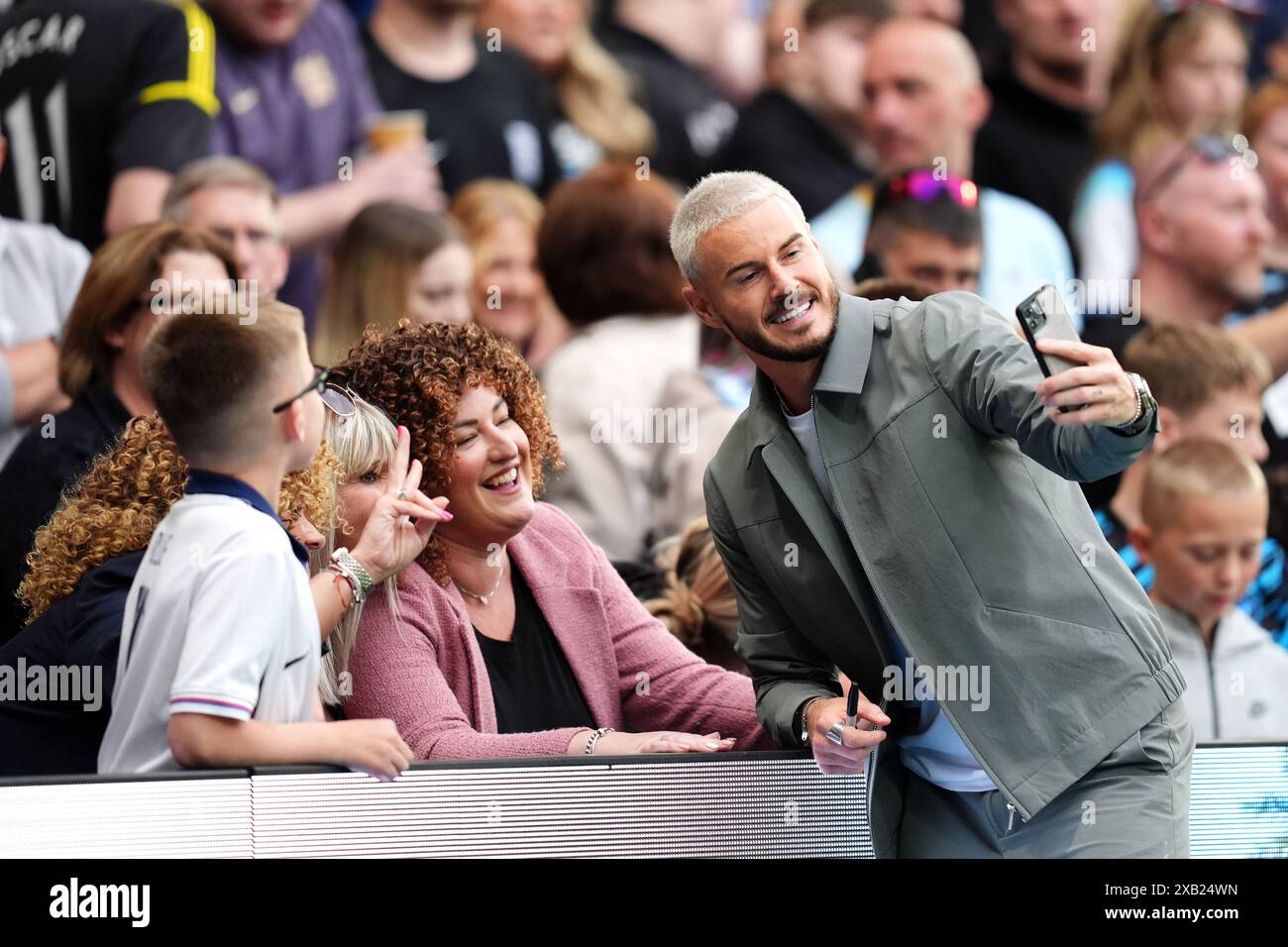 Billy Wingrove take photos with fans before Soccer Aid for UNICEF 2024