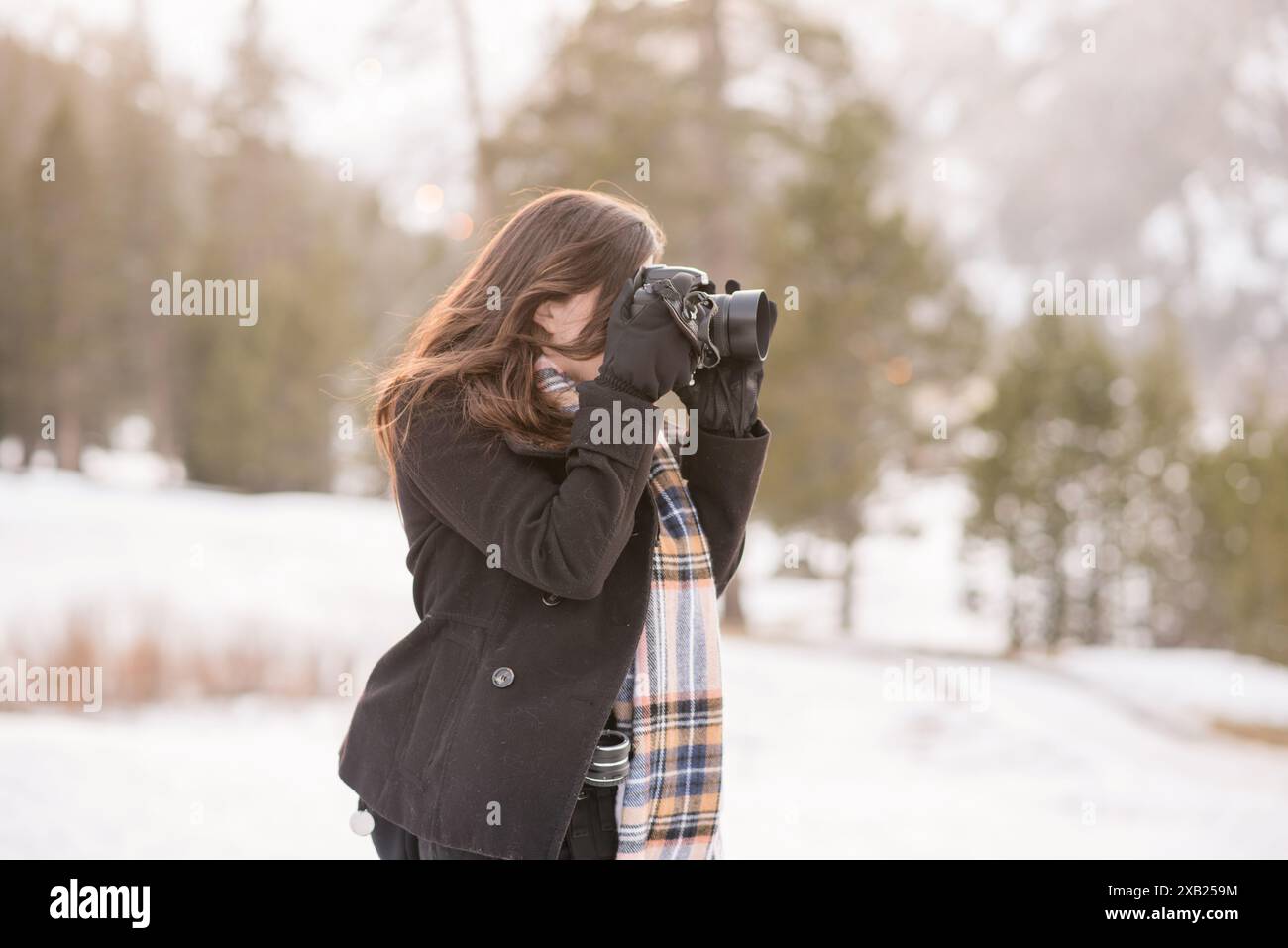 Women taking photos in the snow in lake tahoe Stock Photo