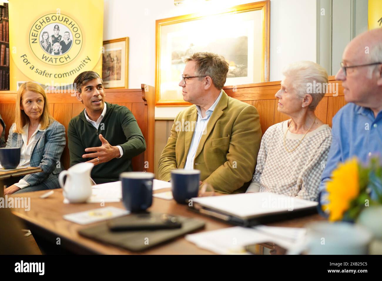 Prime Minister Rishi Sunak attends a neighbourhood watch meeting at the