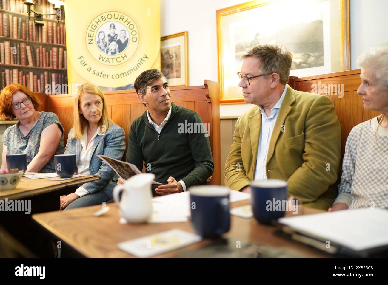 Prime Minister Rishi Sunak attends a neighbourhood watch meeting at the