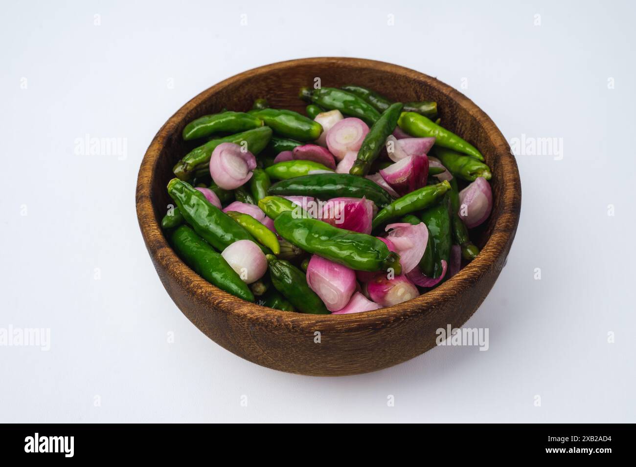 pickle of chili pepper, shallot and garlic with sour brine in a wooden