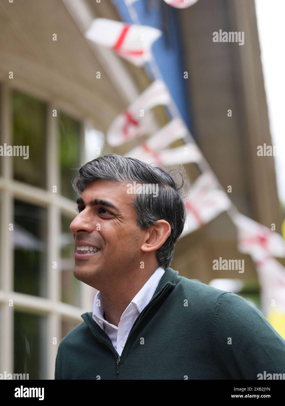 Prime Minister Rishi Sunak arrives to attend a neighbourhood watch meeting at the Dog & Bacon